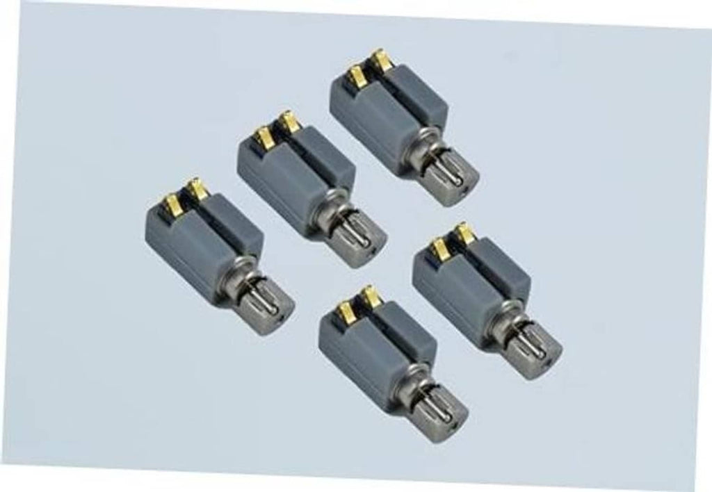 Set of five grey vibration motors with metal pins and gold contact plates
