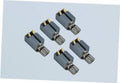 Set of five grey vibration motors with metal pins and gold contact plates