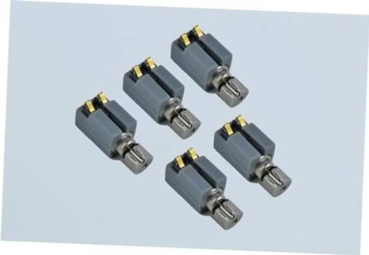 Set of five grey vibration motors with metal pins and gold contact plates
