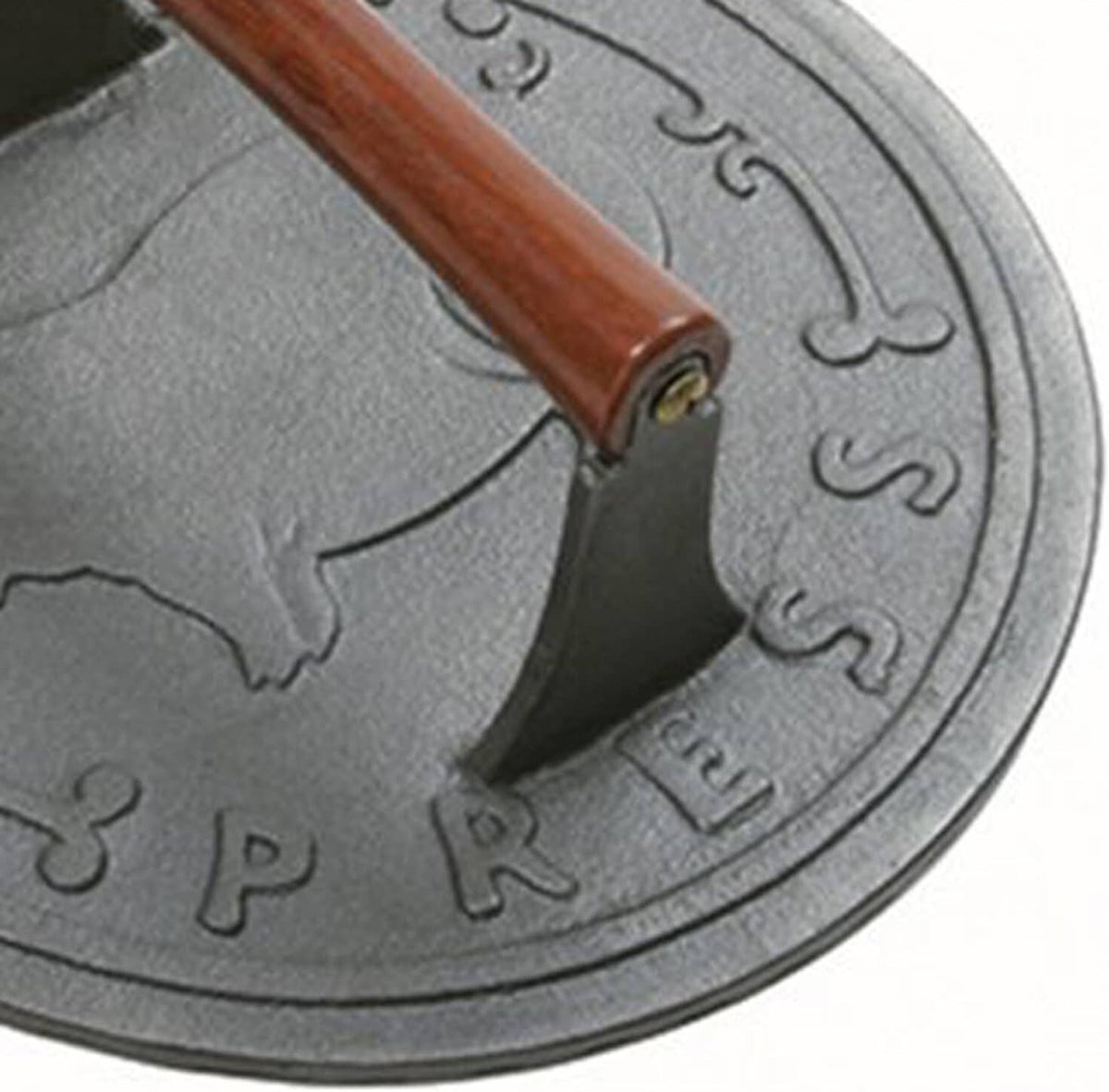 Close-up of cast iron bacon press with wooden handle and embossed number detailing