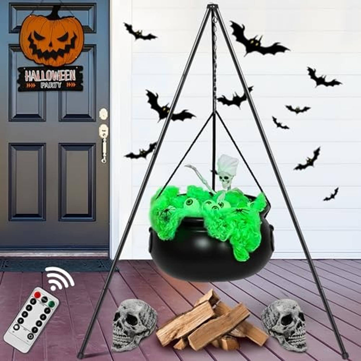 Tripod-hung black witch cauldron with green glowing contents, skulls, and wooden pieces