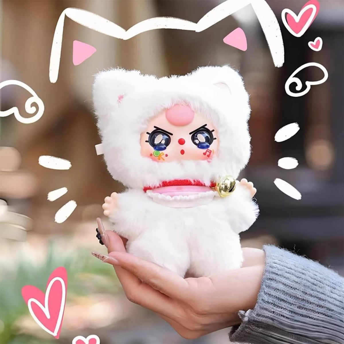 White plush cat doll with pink cheeks and bell collar, small bow-ear details.