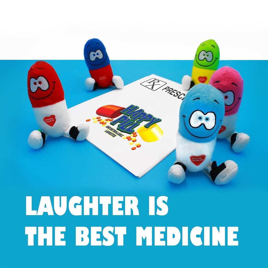 Happy Pill plush cluster in red, blue, green, and purple around a card