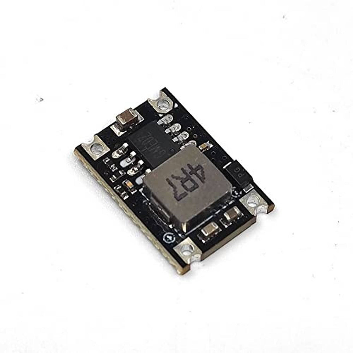 Black DC-DC buck regulator module PCB with dark IC and metal mounting holes