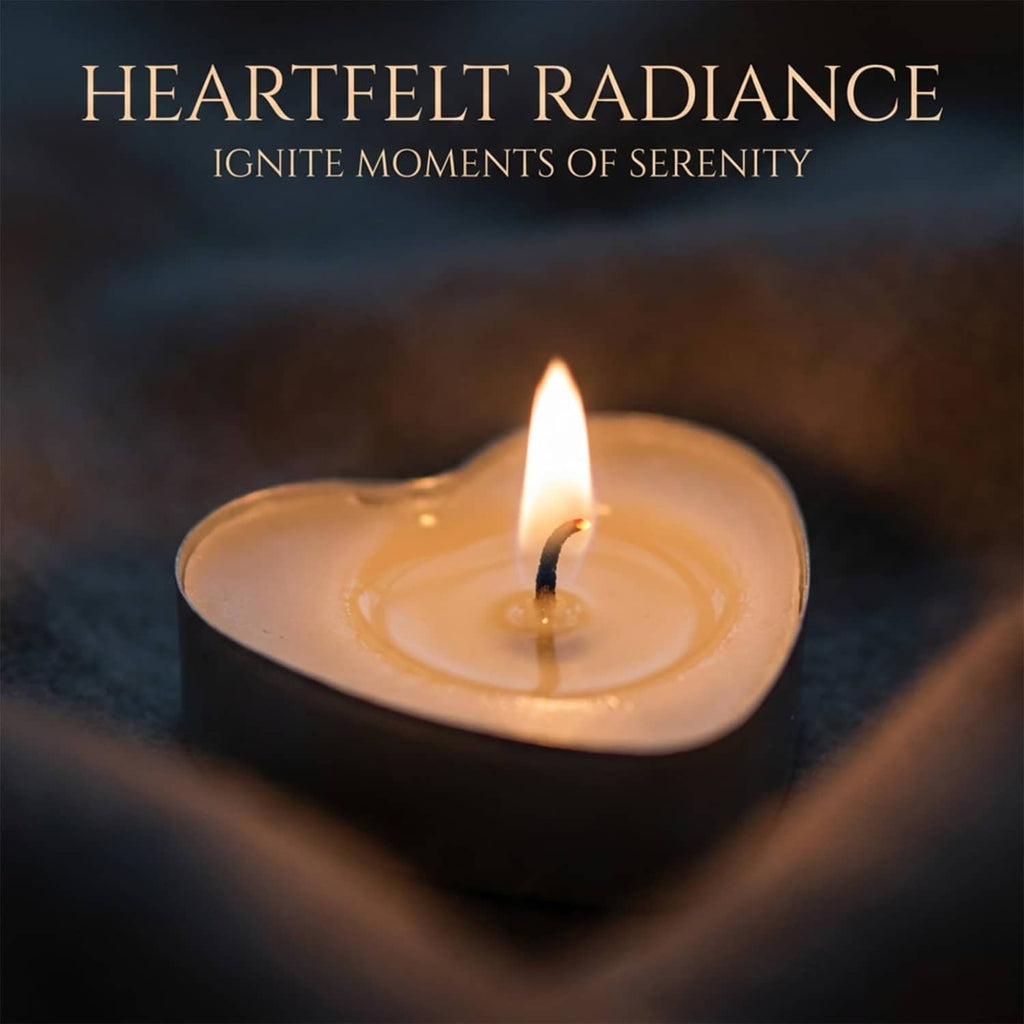 Close-up of a lit white heart-shaped tealight candle in soy wax