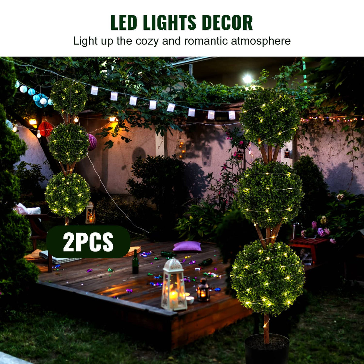 Outdoor LED-lit artificial topiary trees with stacked green foliage in black pots