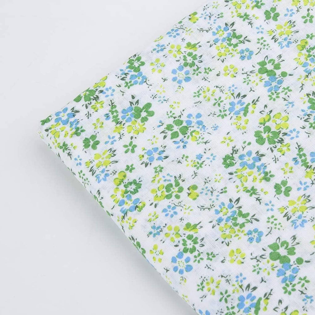 Cotton fabric square with white background and blue-green flower sprig pattern