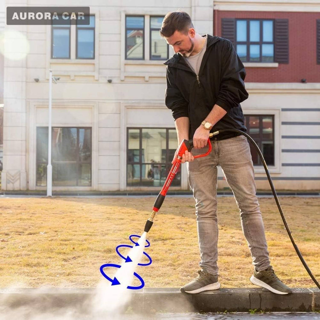 Turbo nozzle pressure washer spraying water, black-and-brass tip in use