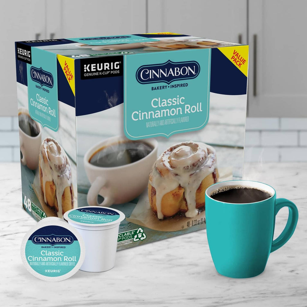 Cinnabon Classic Cinnamon Roll K-Cup pods box with cup and cinnamon rolls