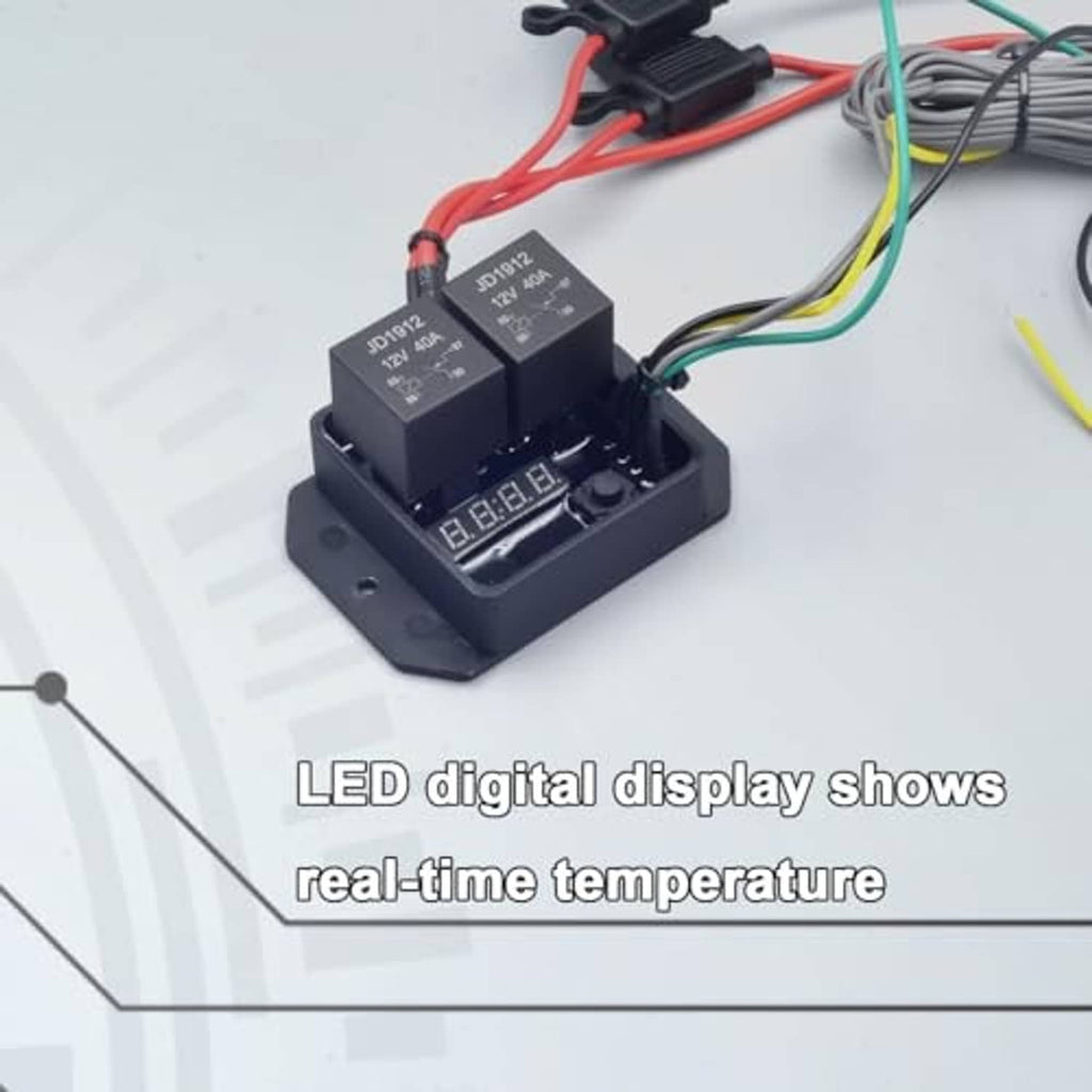 Close-up of digital radiator fan controller module with LED window and multi-color wires