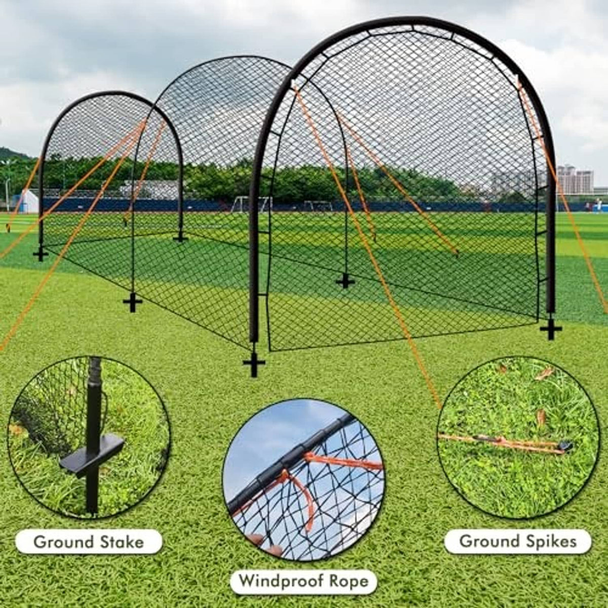 Portable batting cage setup with ground stakes and windproof ropes on grass field