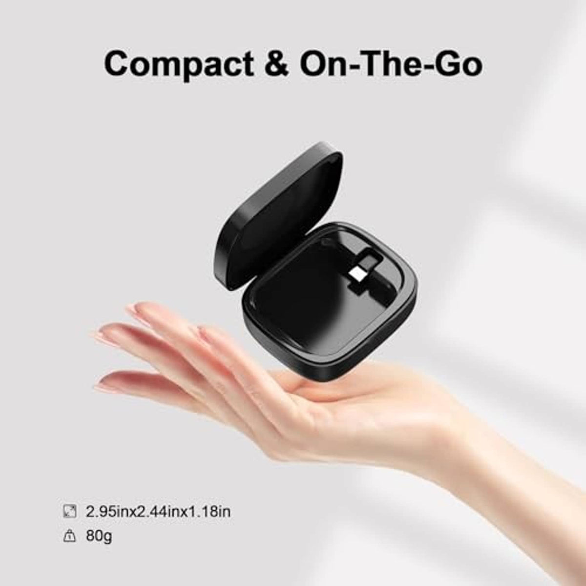 Compact black wireless charging case open in a hand for on-the-go charging