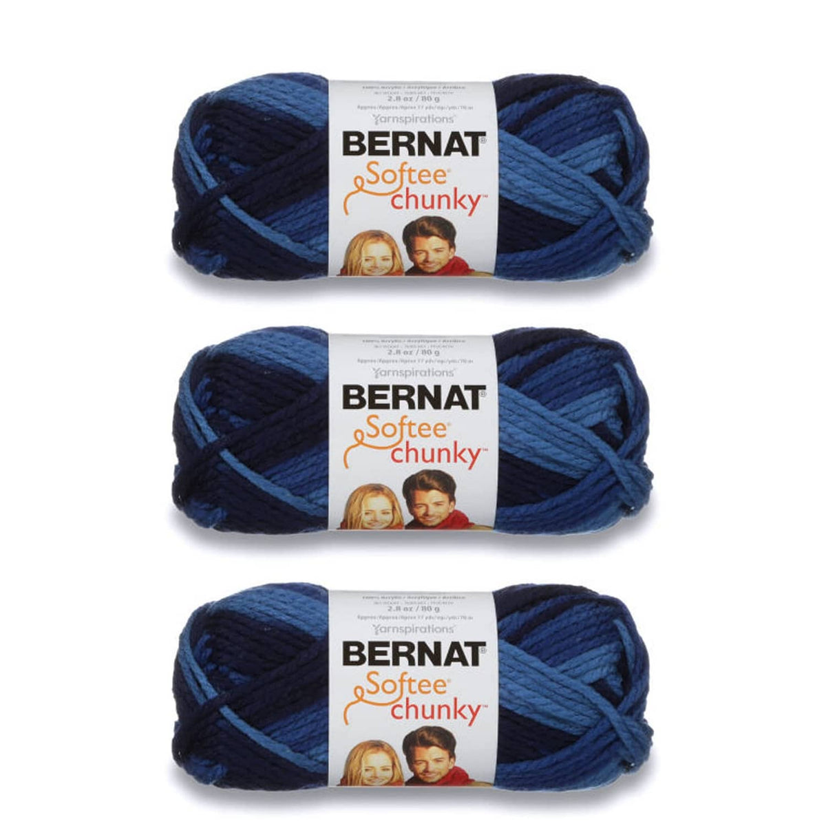 Three Bernat Softee Chunky yarn skeins in denim ombre, super bulky
