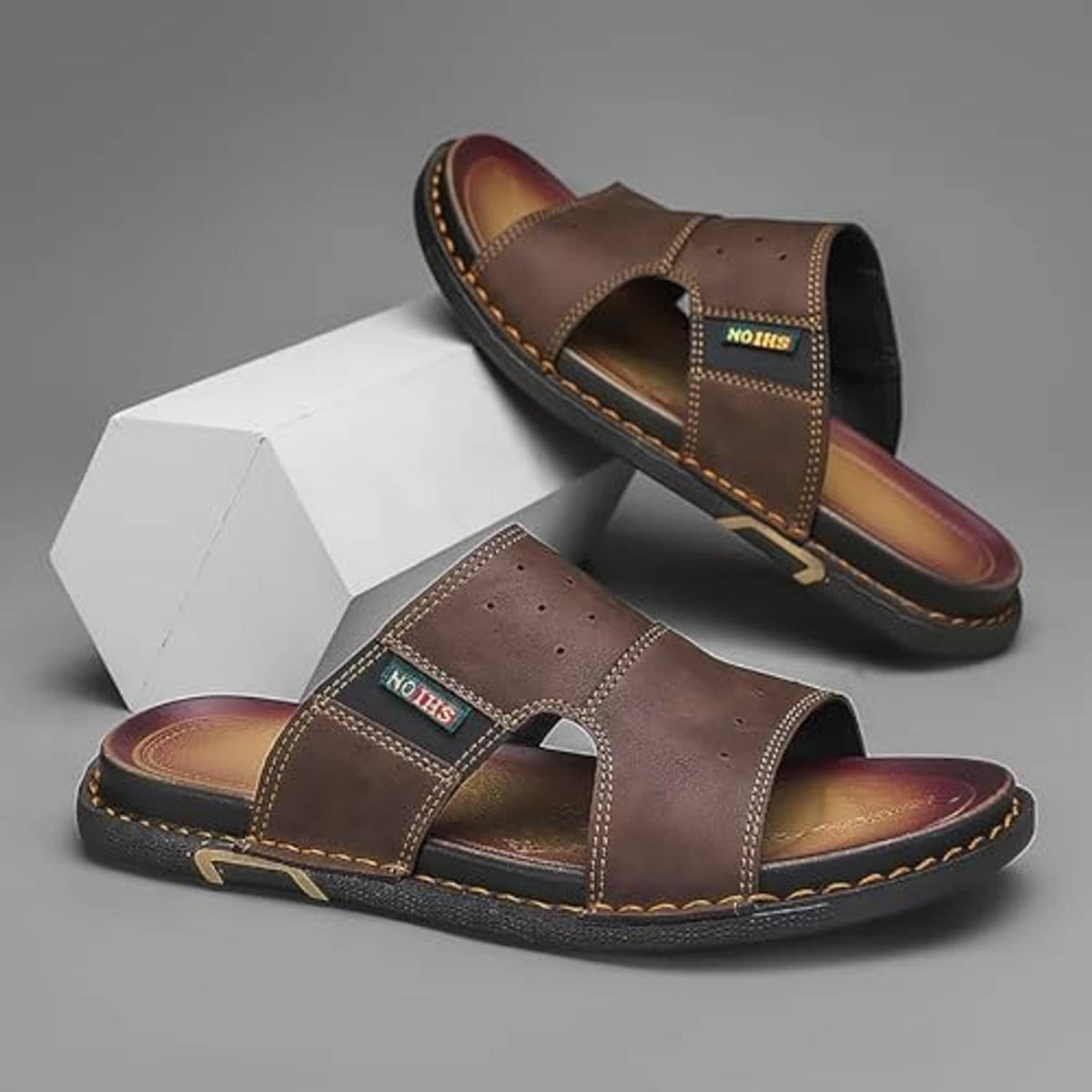 Men's brown leather open-toe slip-on slide sandals, pair shown with cushioned outsole