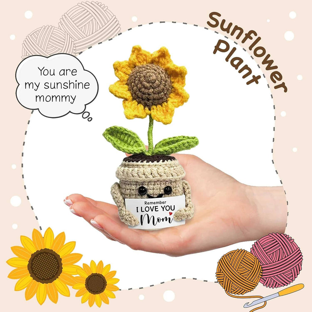 Crocheted sunflower in beige pot with yellow petals and green leaves; 'Remember I love you Mom' label