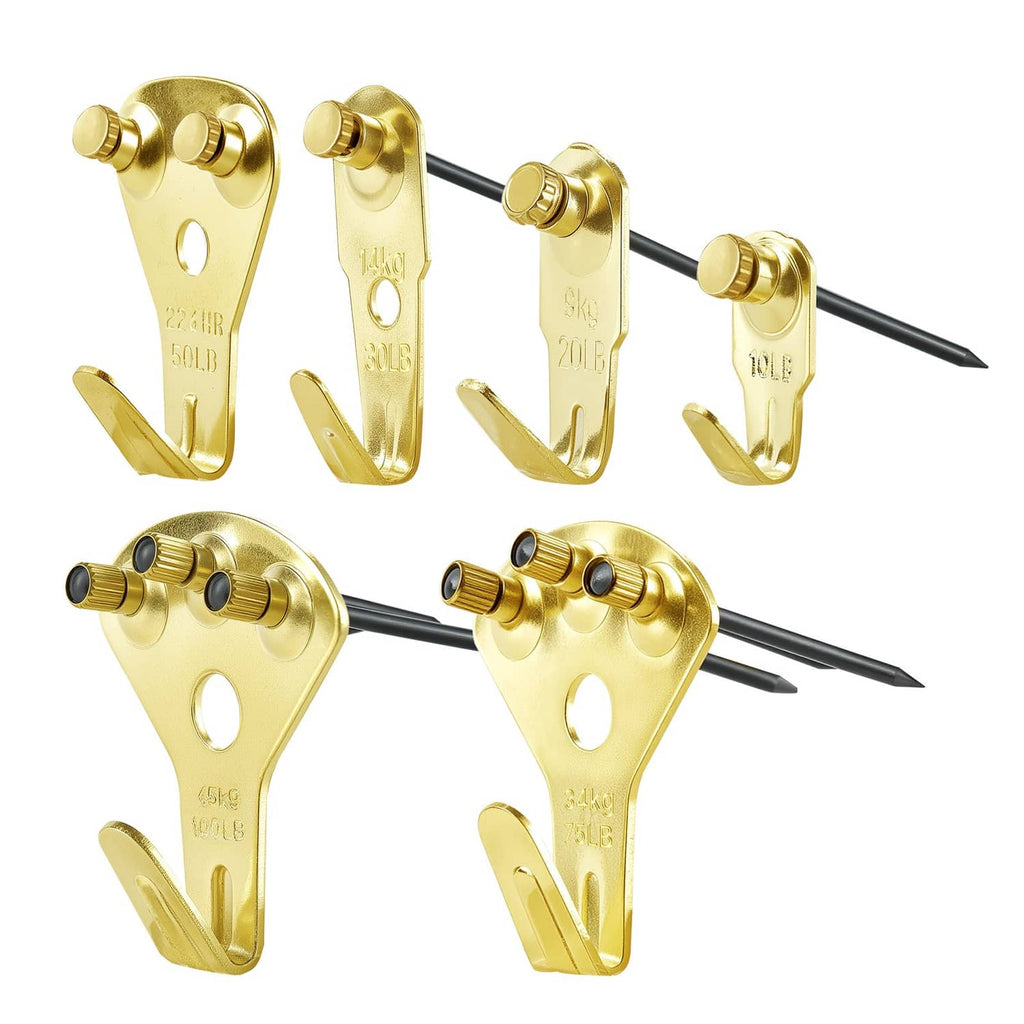 Gold metal picture hanging hooks with attached nails, multiple sizes shown