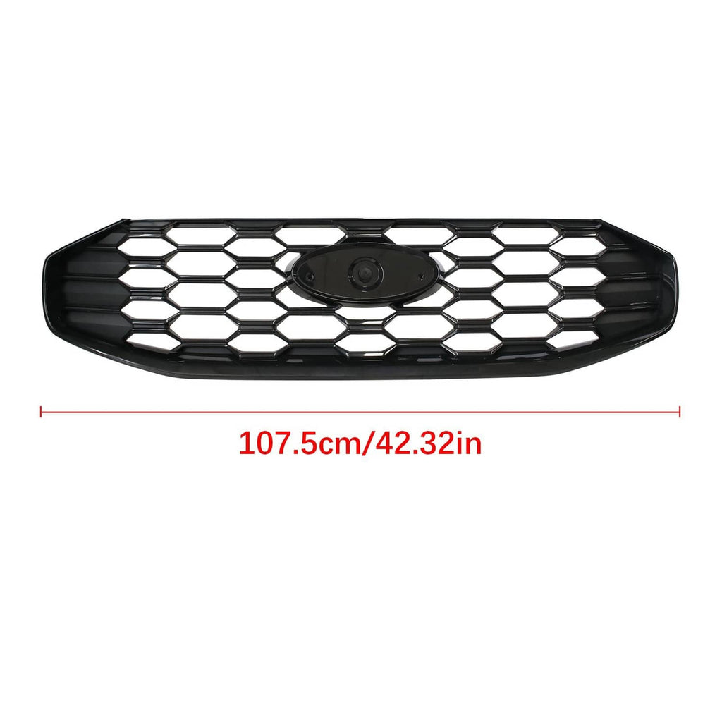 Black front grille with hex honeycomb pattern and central emblem opening