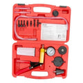 Red brake bleeder kit case with vacuum pump tester gauge and hand tool adapters