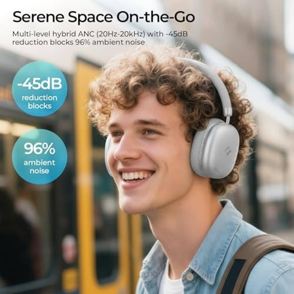 Silver over-ear wireless headphones worn by a person with cushioned earcups