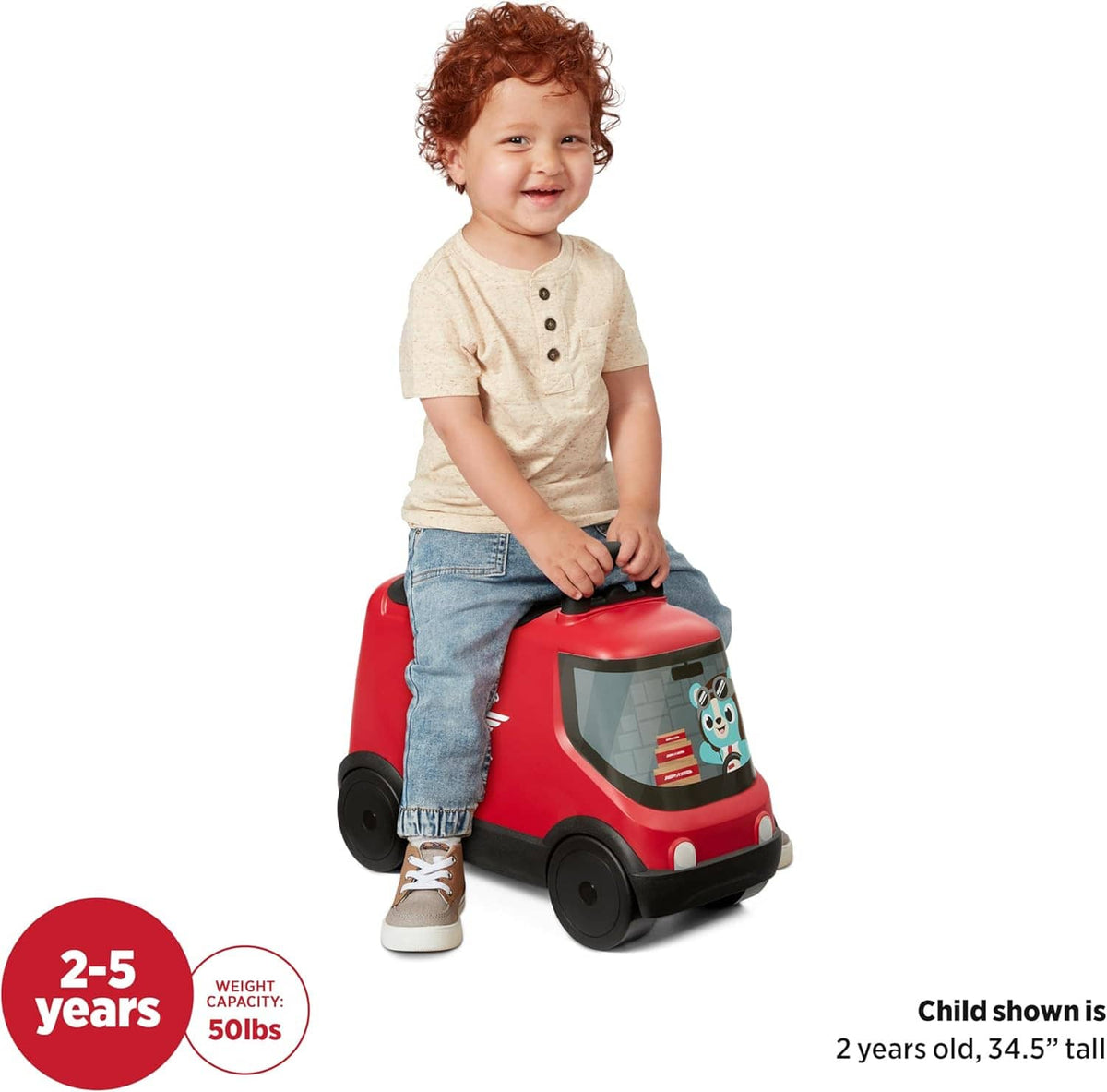 Red ride-on delivery truck toy with clear window; toddler seated, side view