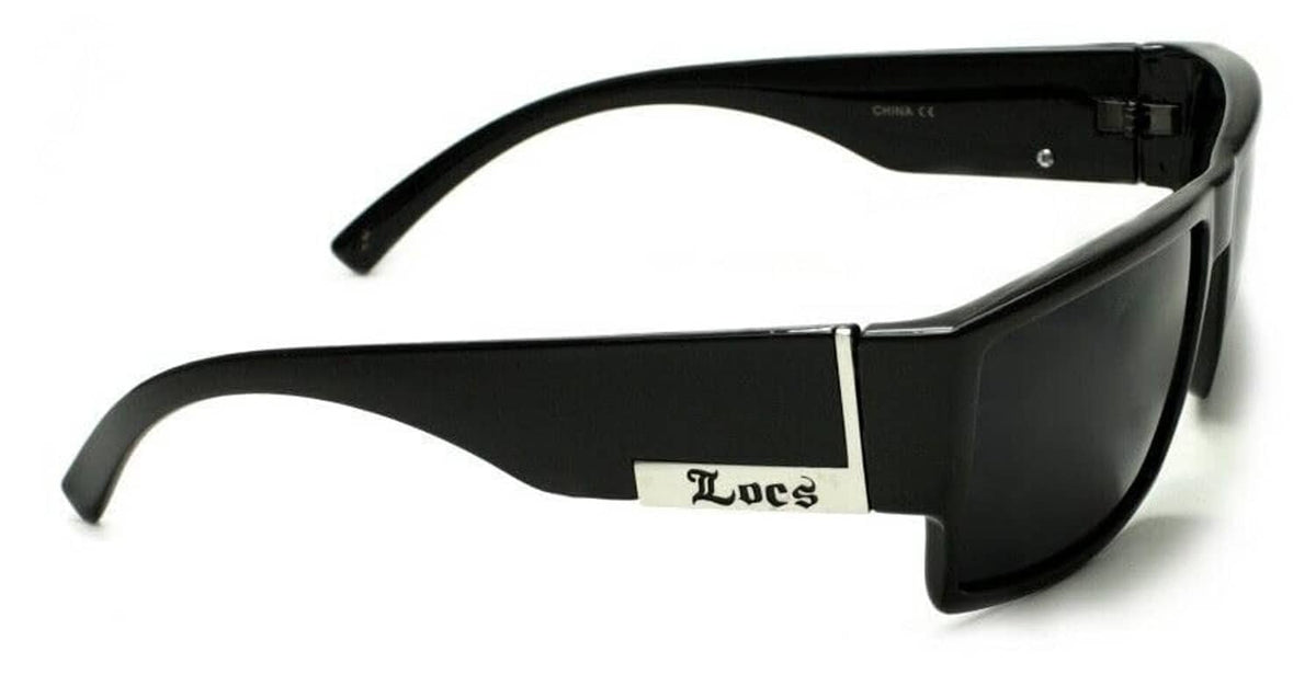Black sunglasses side view with dark lenses and silver-toned hinge details
