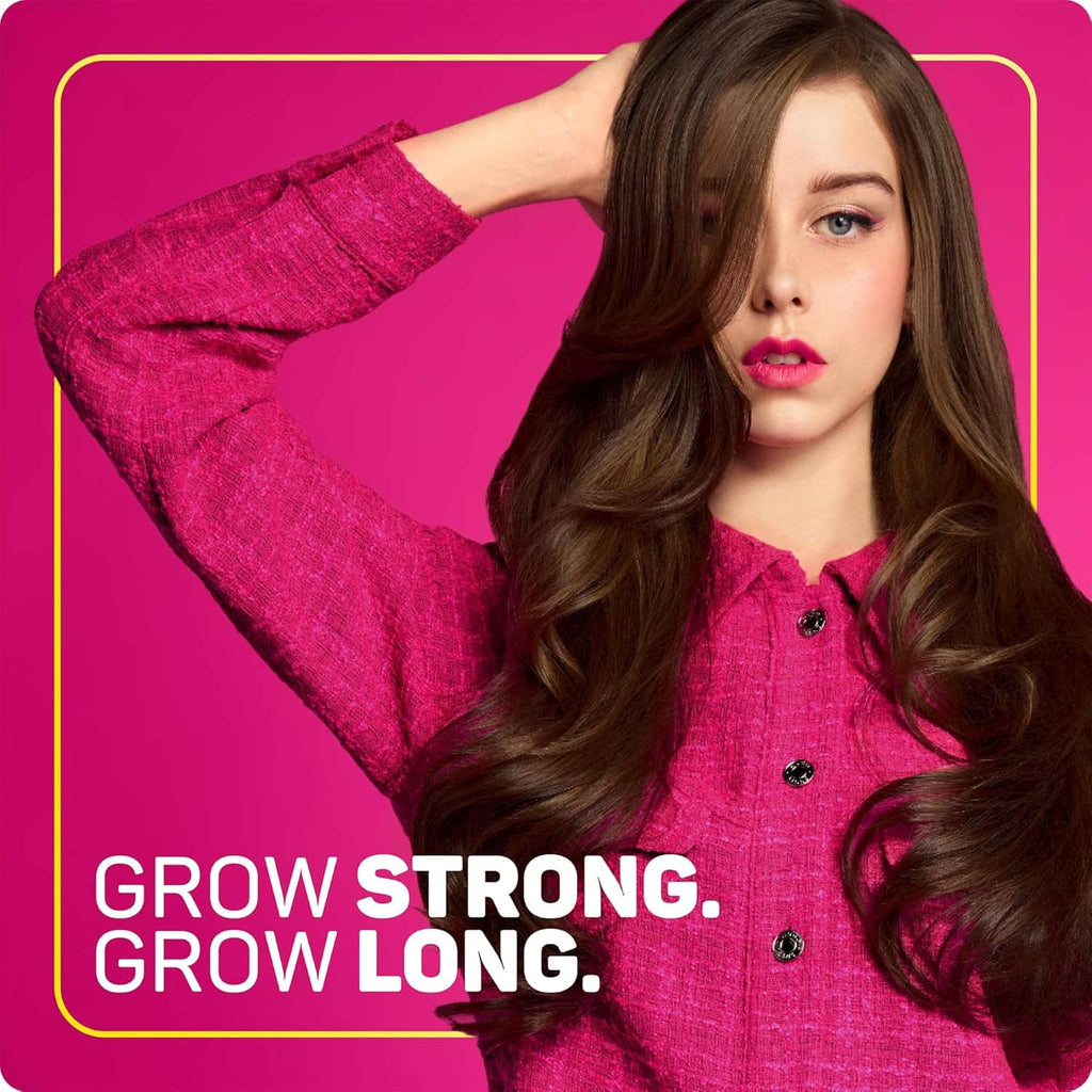 Woman with long wavy brown hair showcasing Grow Long styling