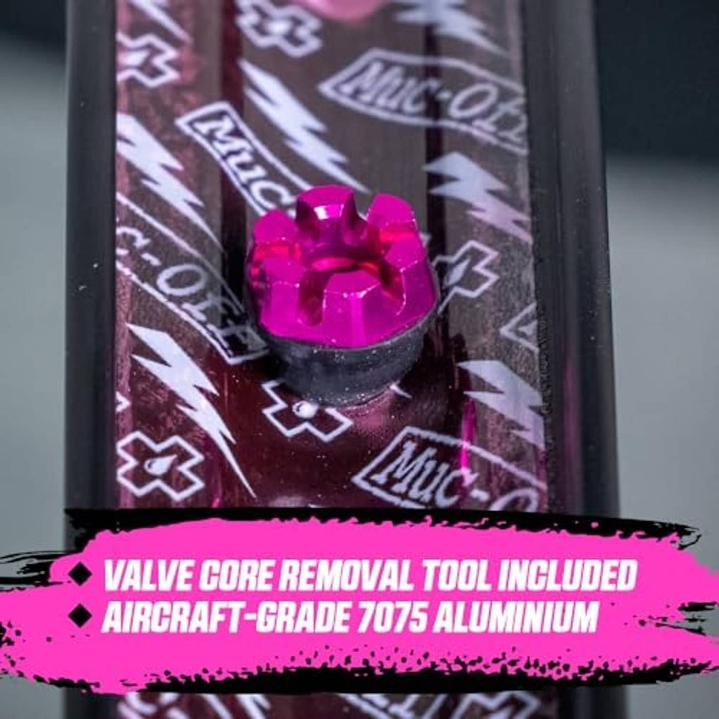 Pink Presta tubeless valve head detail with textured top and knurled collar