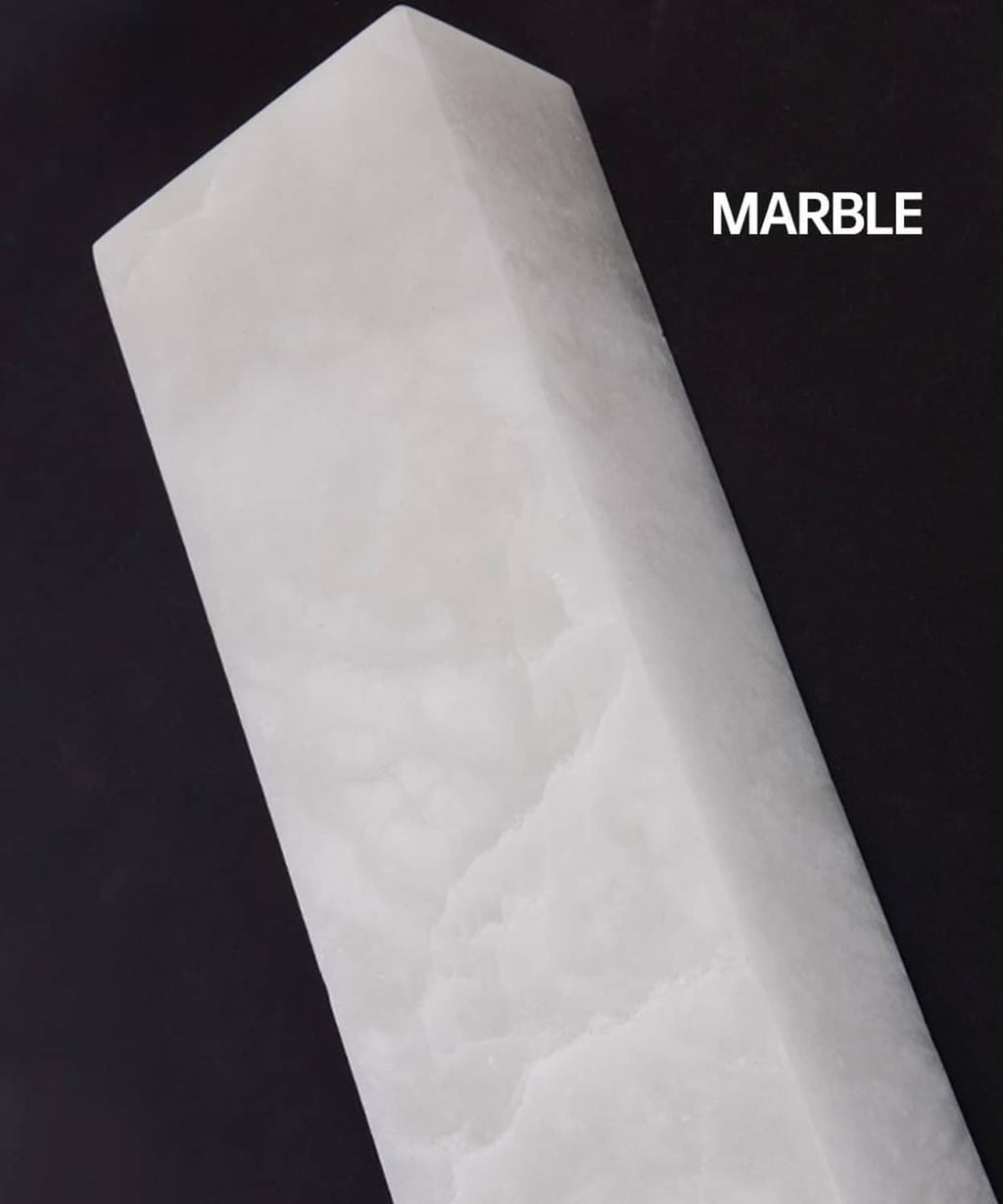 White marble light panel with subtle veining and faceted rectangular shape