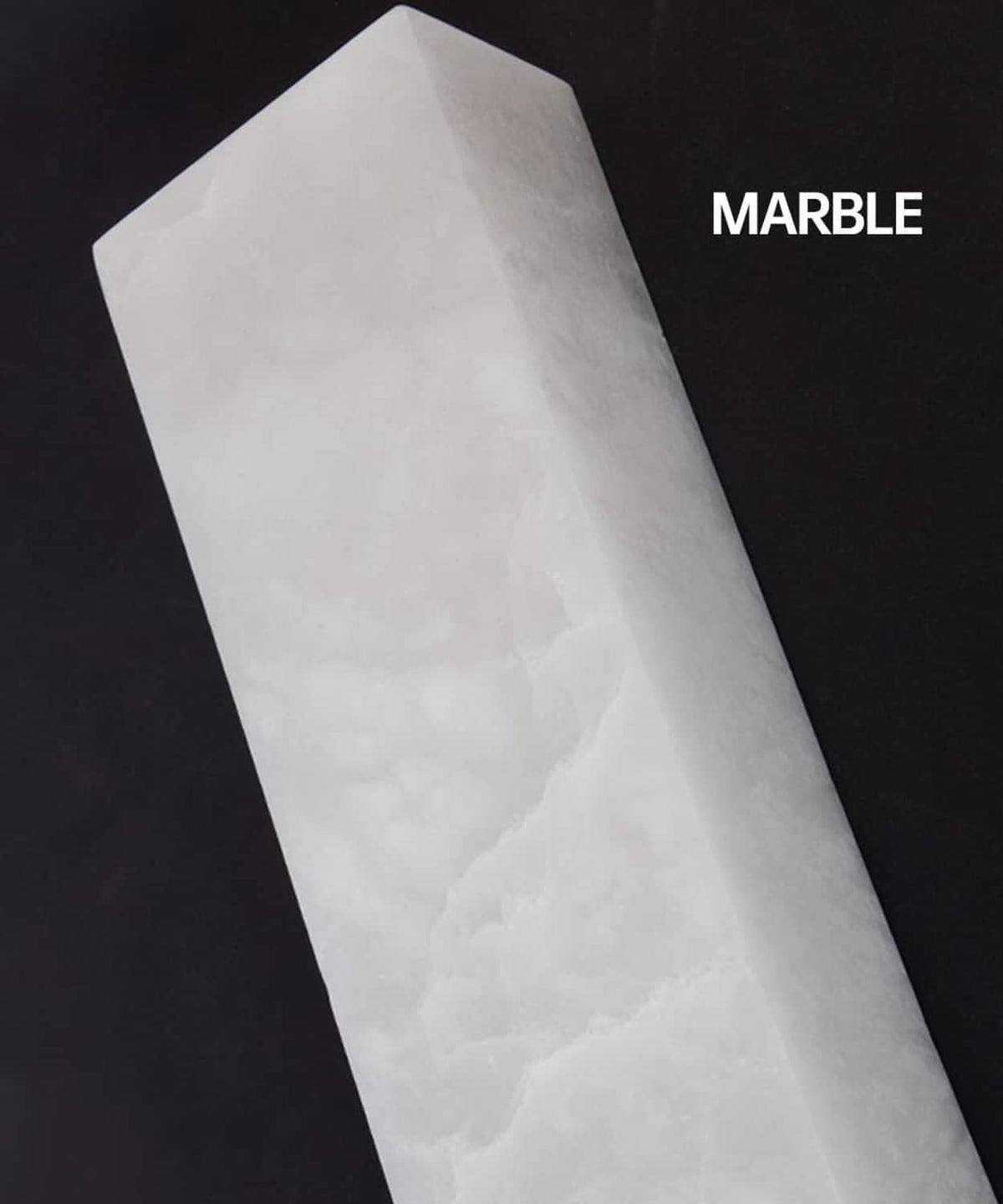 White marble light panel with subtle veining and faceted rectangular shape