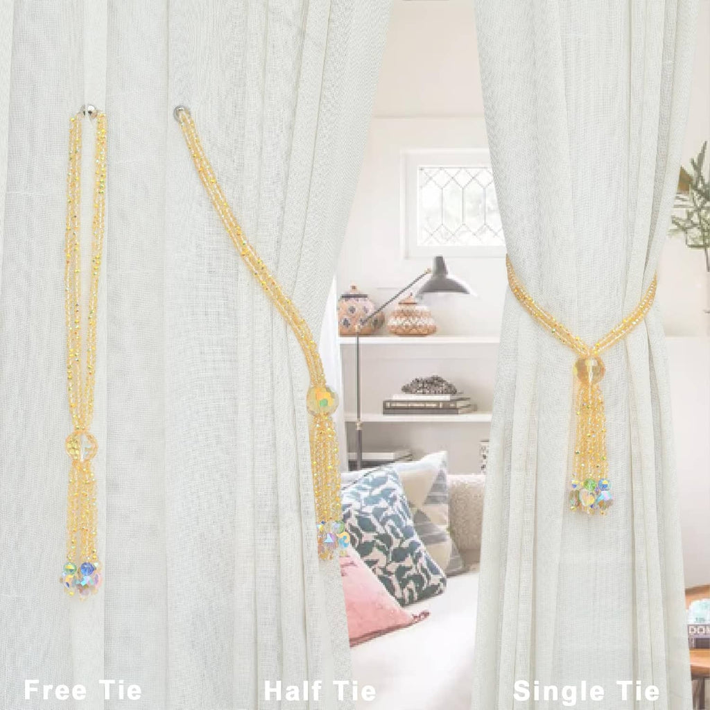 Gold beaded curtain tiebacks with long crystal tassel ornaments on sheer curtain folds