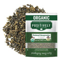 Organic pinhead gunpowder green tea pouch with loose dark green leaves