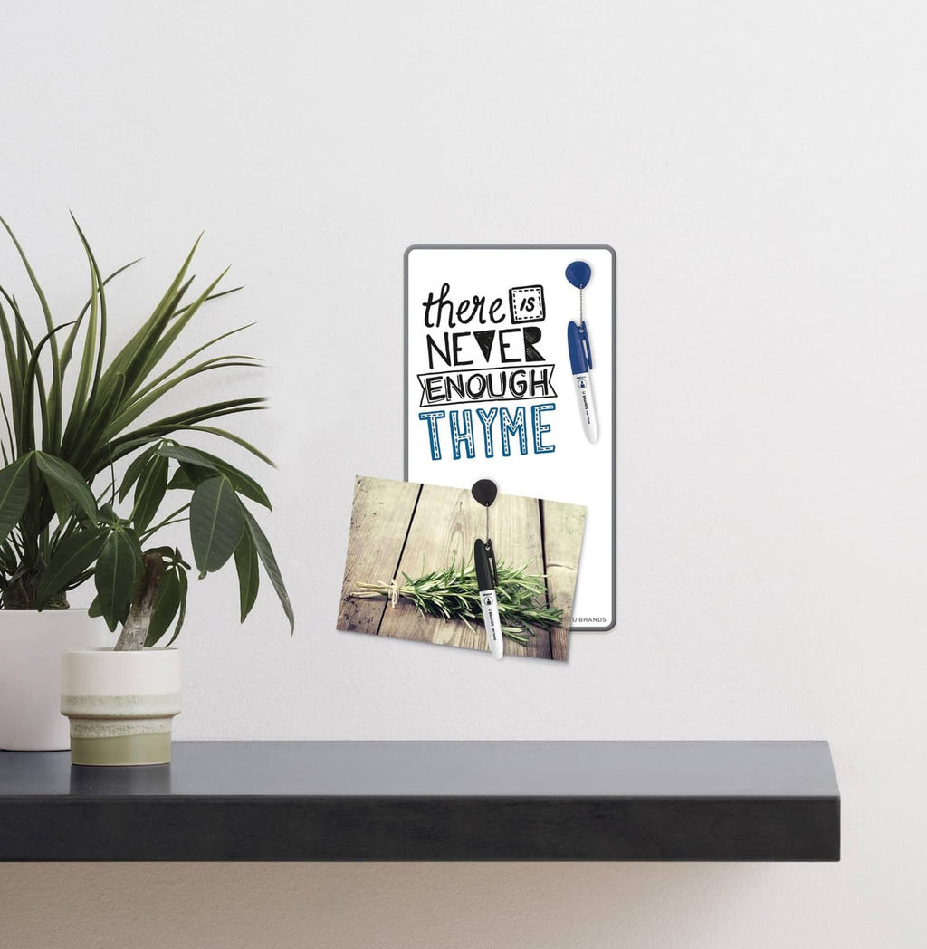 Magnetic white dry erase board with magnet-held note cards on wall