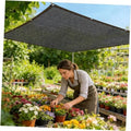 Black garden shade cloth canopy with grommets along the edges, mesh fabric cover.