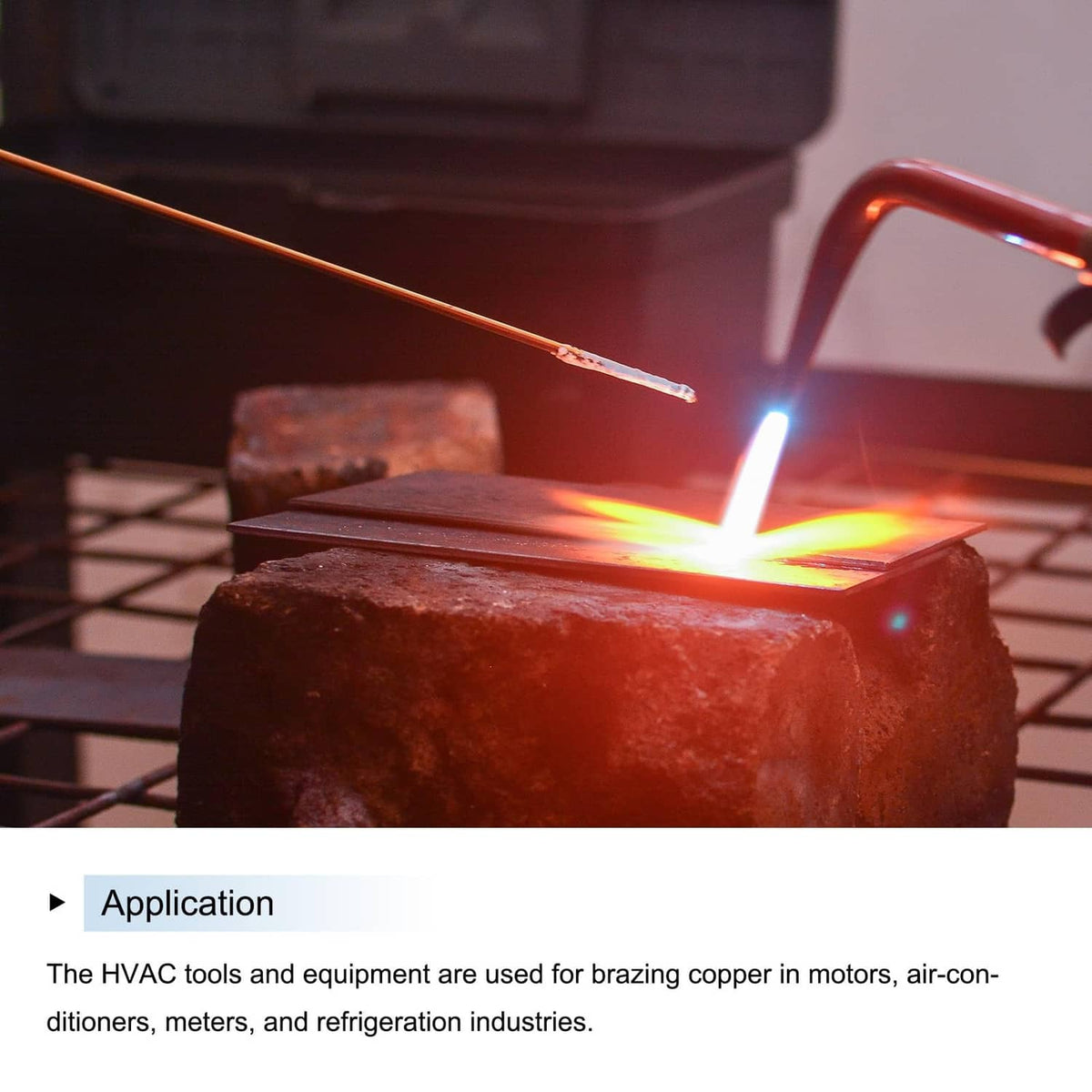 Copper brazing rod held near a brazing flare, showing the rod tip