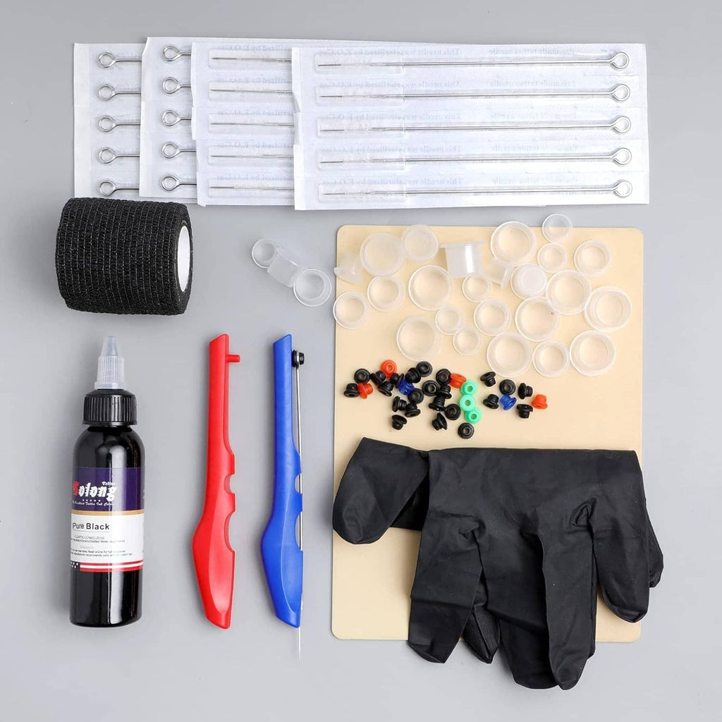 Tattoo kit accessories set with black gloves, ink bottle, needle trays, and rubber grip wrap