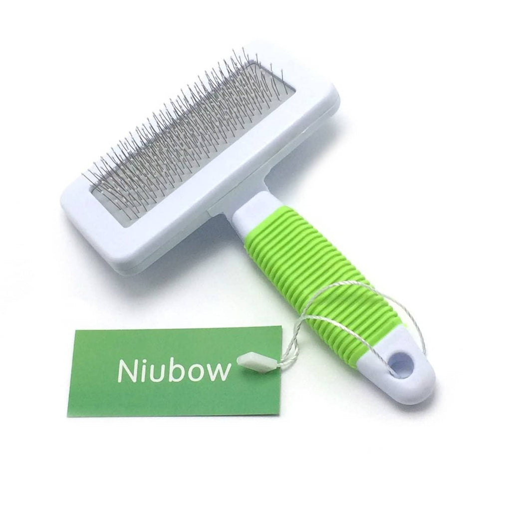Pet slicker brush with white head, coated metal pins, and green grip handle.