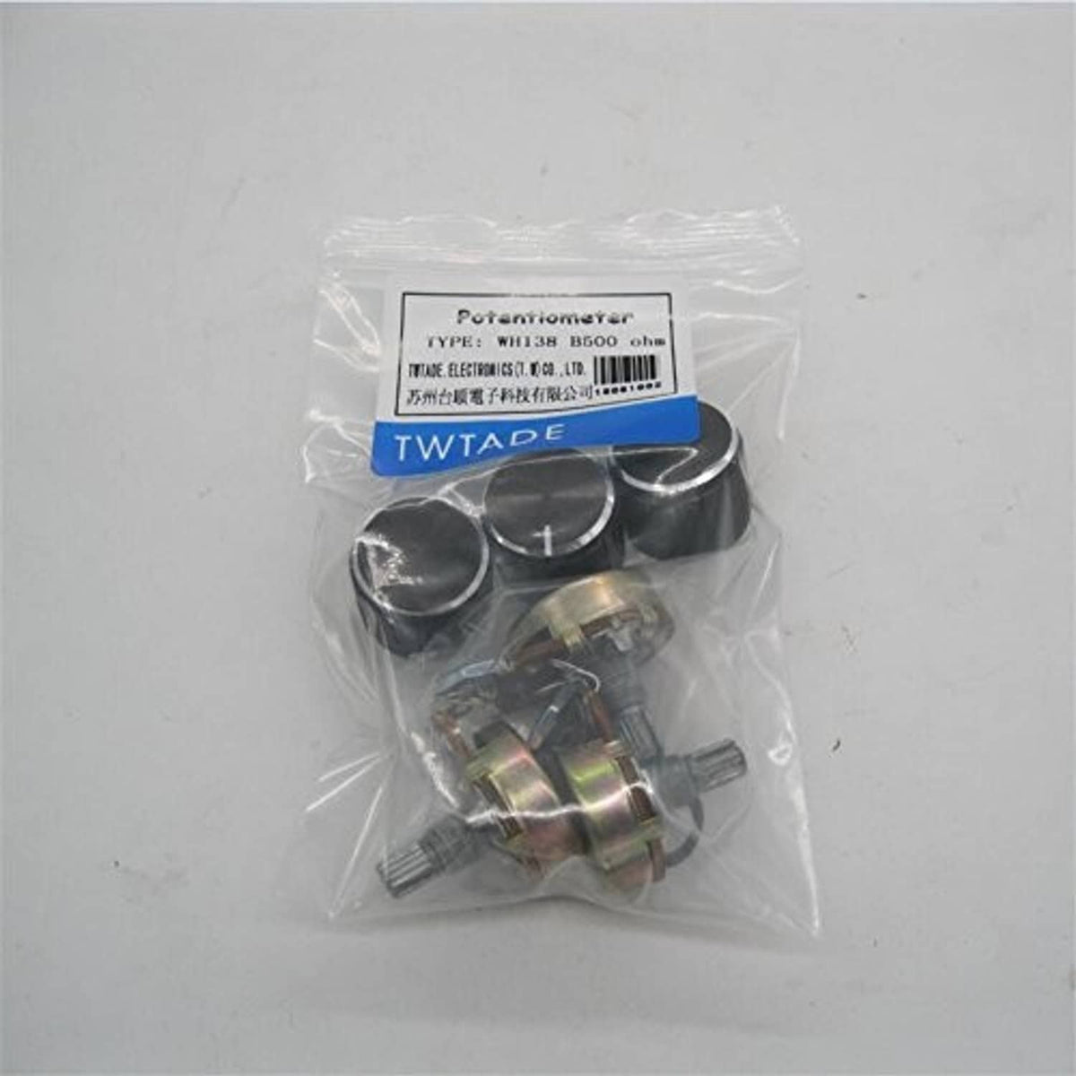 Bagged potentiometer set with black knobs and small metal components, TWTADE label.