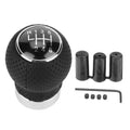 Round black 6-speed car shift knob with chrome ring, numbered gear pattern and parts kit