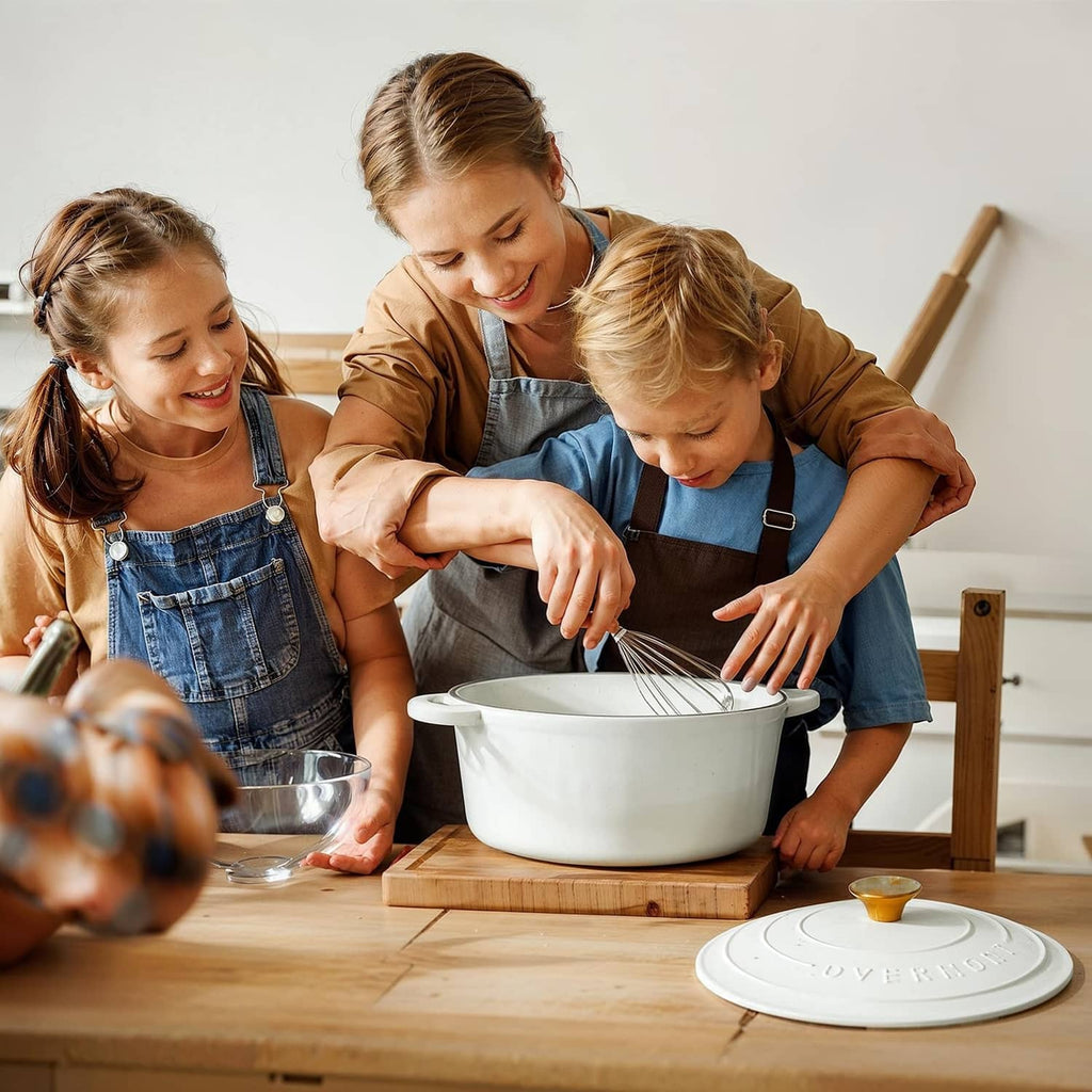 Pearl white enameled Dutch oven on table with lid, family cooking scene