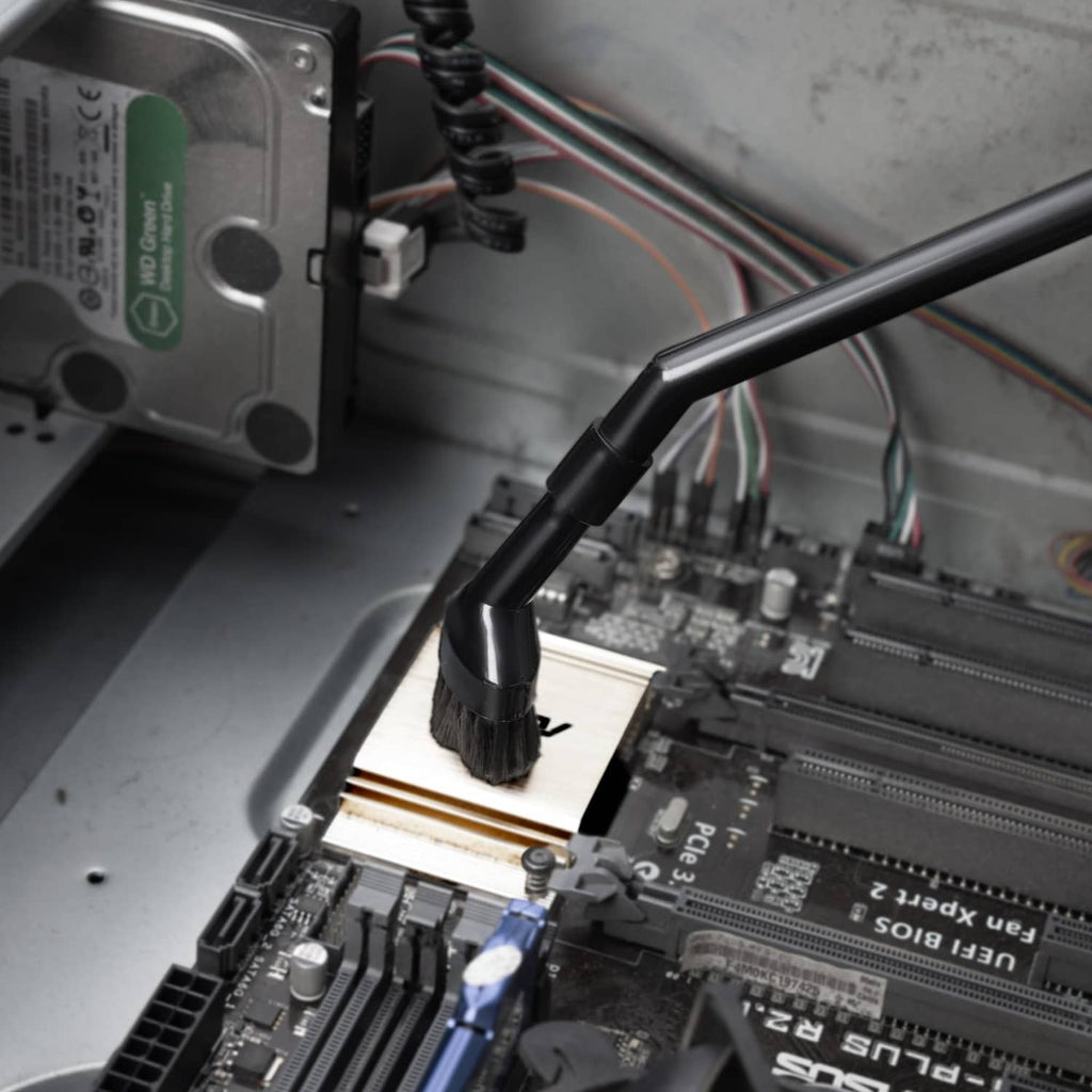 Black micro brush nozzle cleaning circuit board and components in a computer
