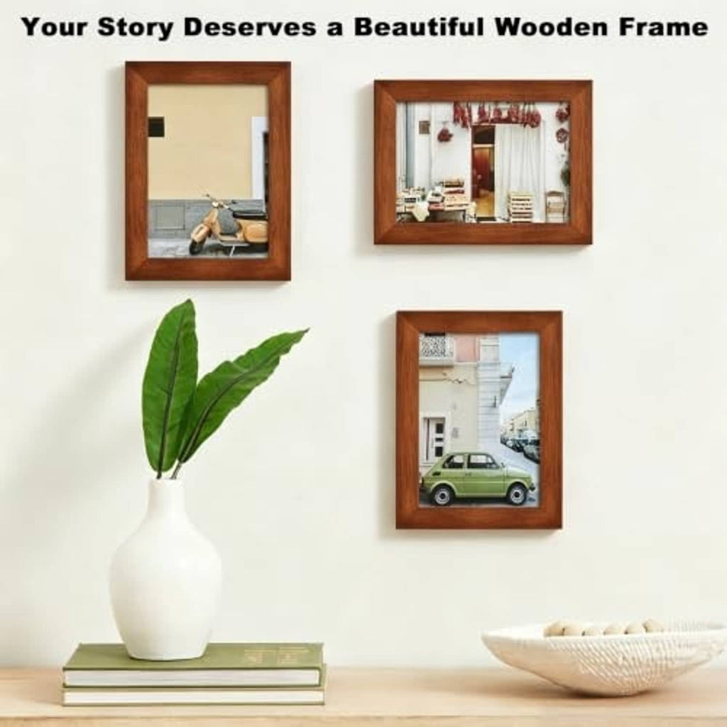 Three brown wood picture frames with glass covers featuring different photos