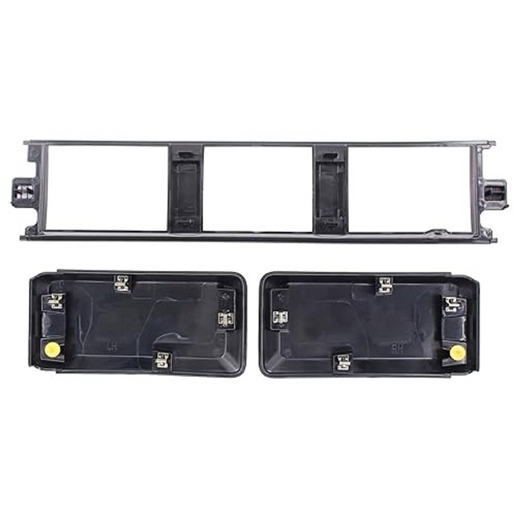 Black grille trim panel frame with two housings, mounting clips, and yellow locator pins