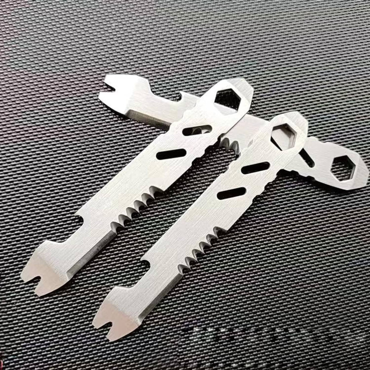 Two-pack stainless steel fire starter striker tools, silver with serrated edge and hex holes