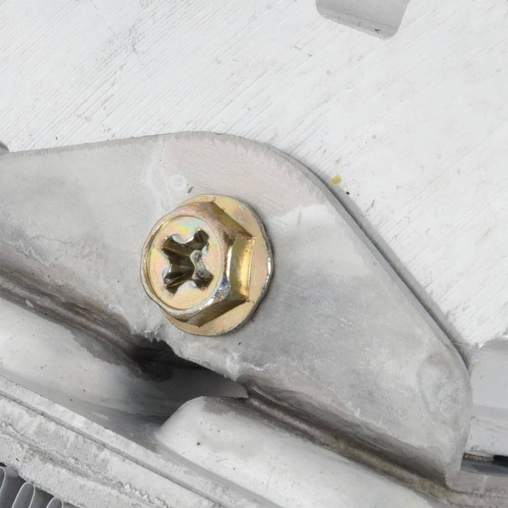 Automatic transmission oil cooler close-up of mounting bolt on metal housing