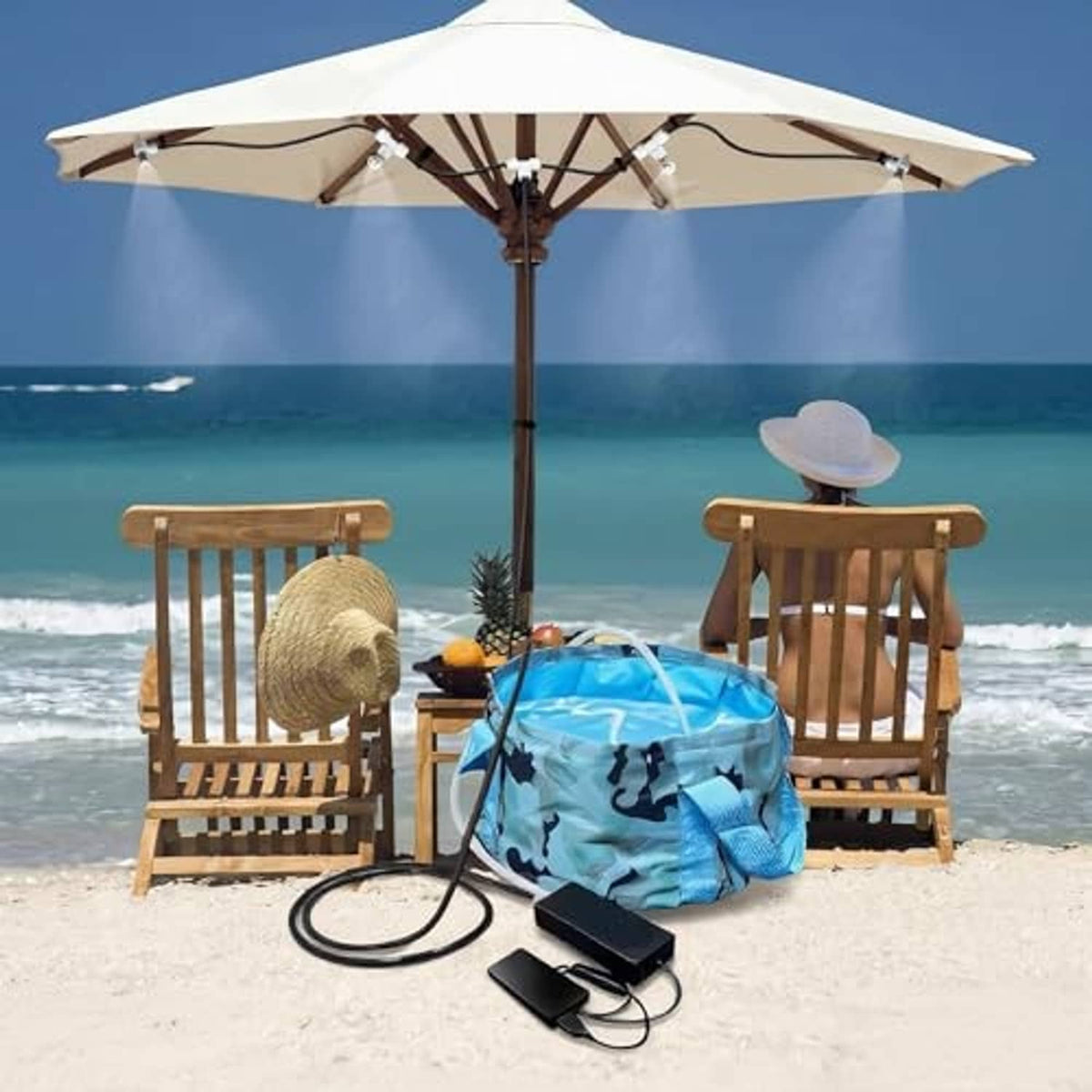 Portable misting system set with blue foldable bucket, black pump, and tubing for nozzles