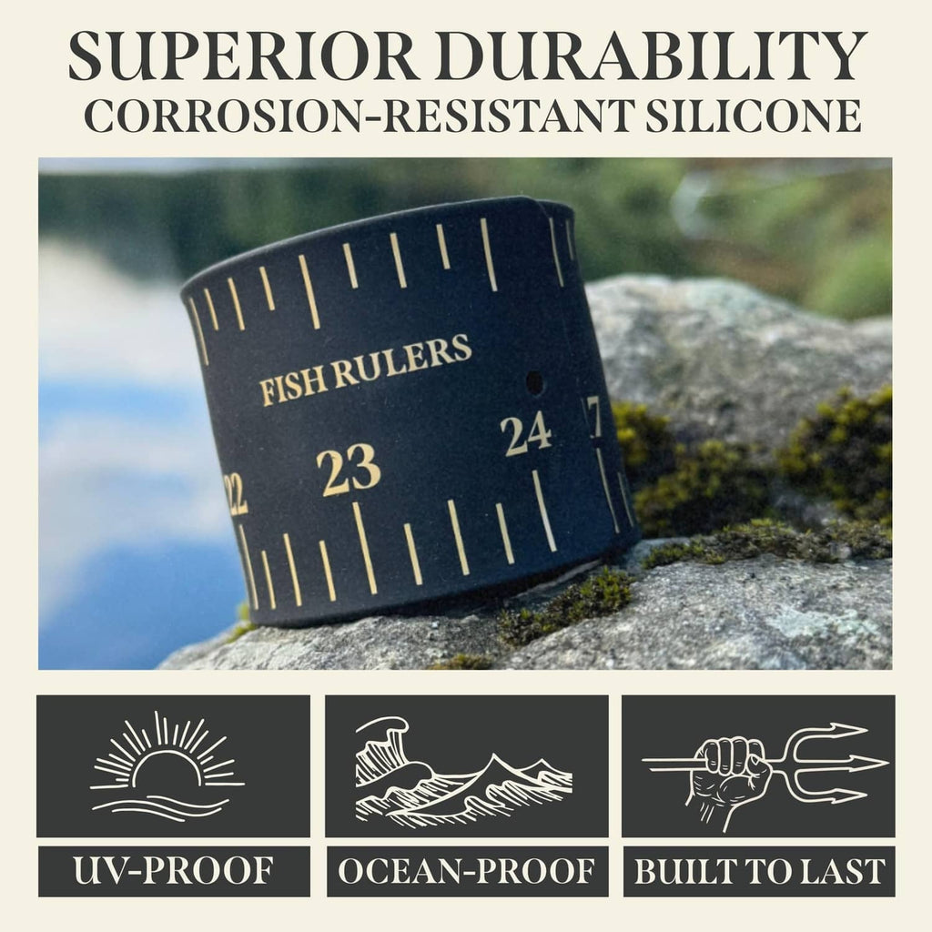 Black roll-up fish ruler band with gold inch markings on outdoor rock surface