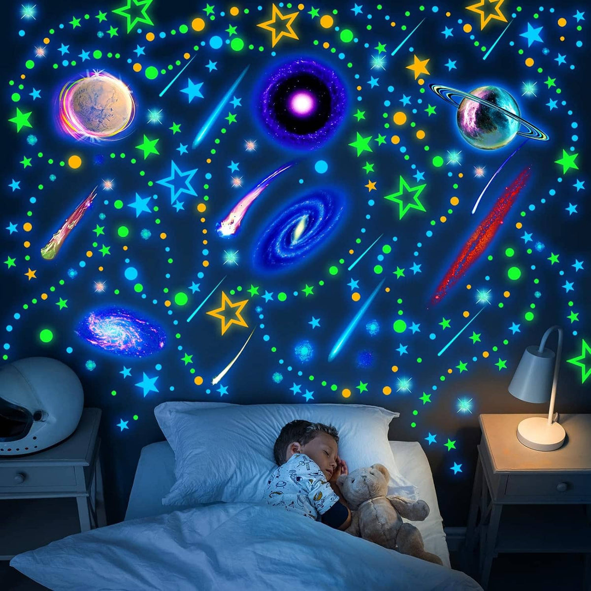 Glow-in-the-dark space wall decals with colorful planets, rings, and star shapes