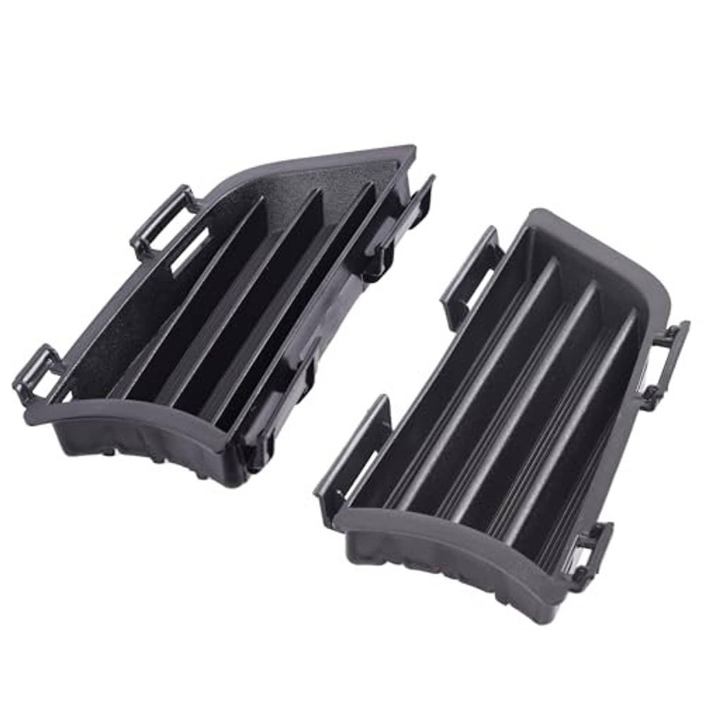 Front fog light grille covers, black plastic with vertical slats and mounting tabs