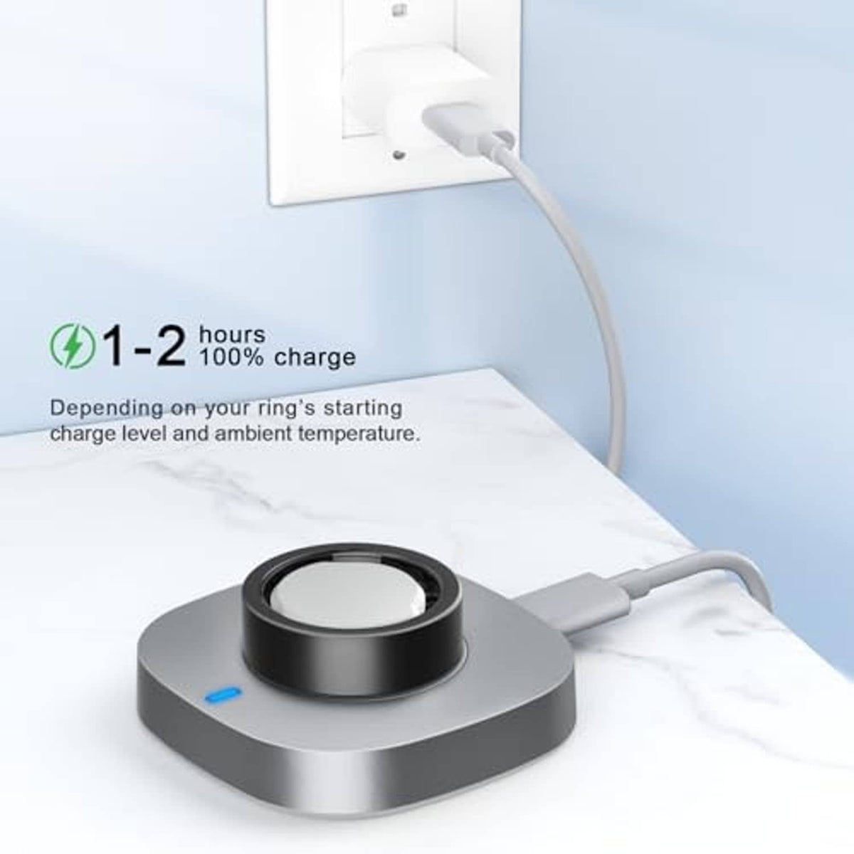 Gray charging dock with black ring and blue indicator, USB-C connector on cable