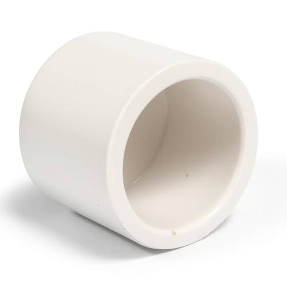White PVC pipe end cap fitting, round socket with beveled rim